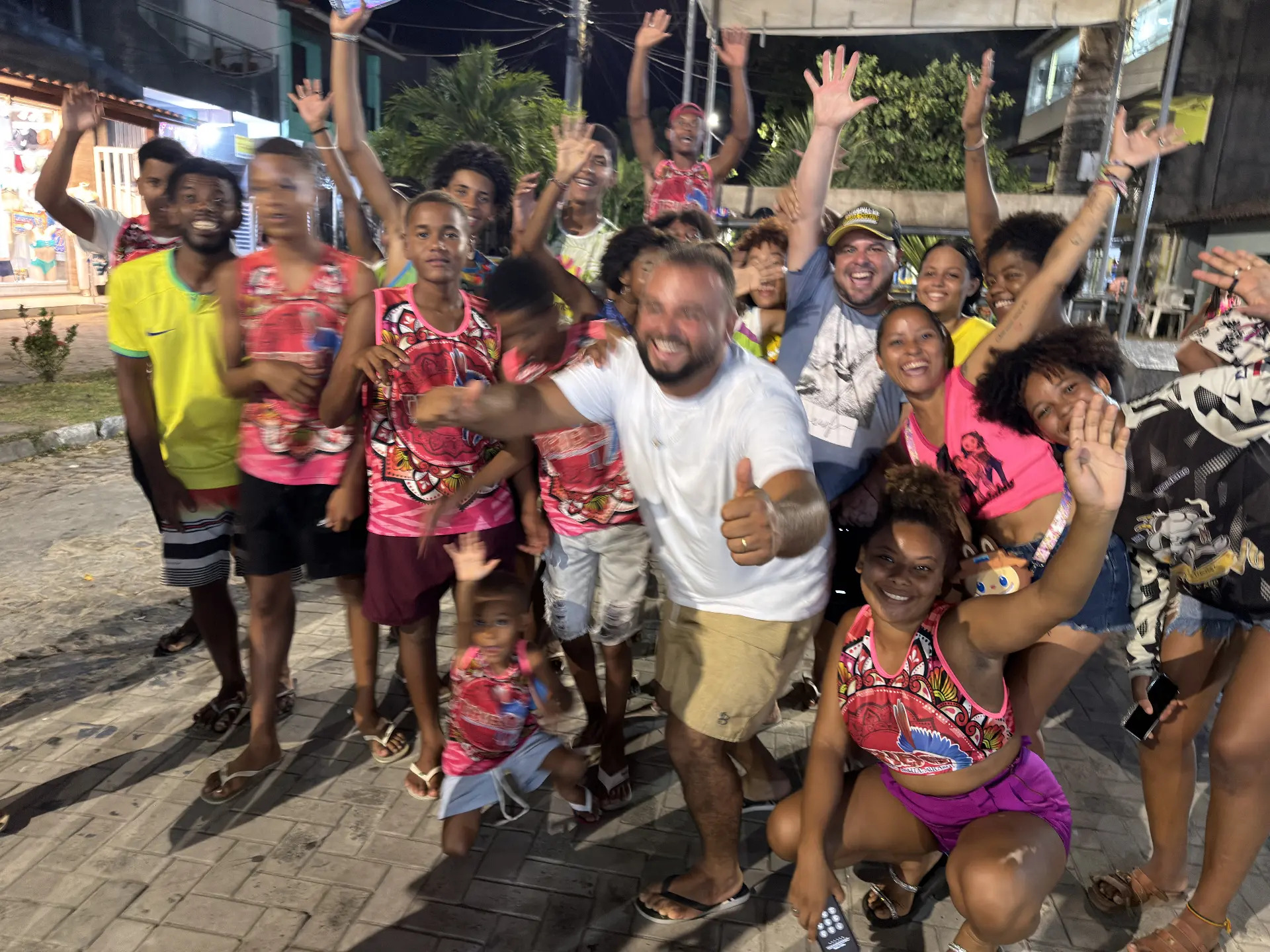 TRIBO members and the local community of Gamboa smiling together at an evening gathering