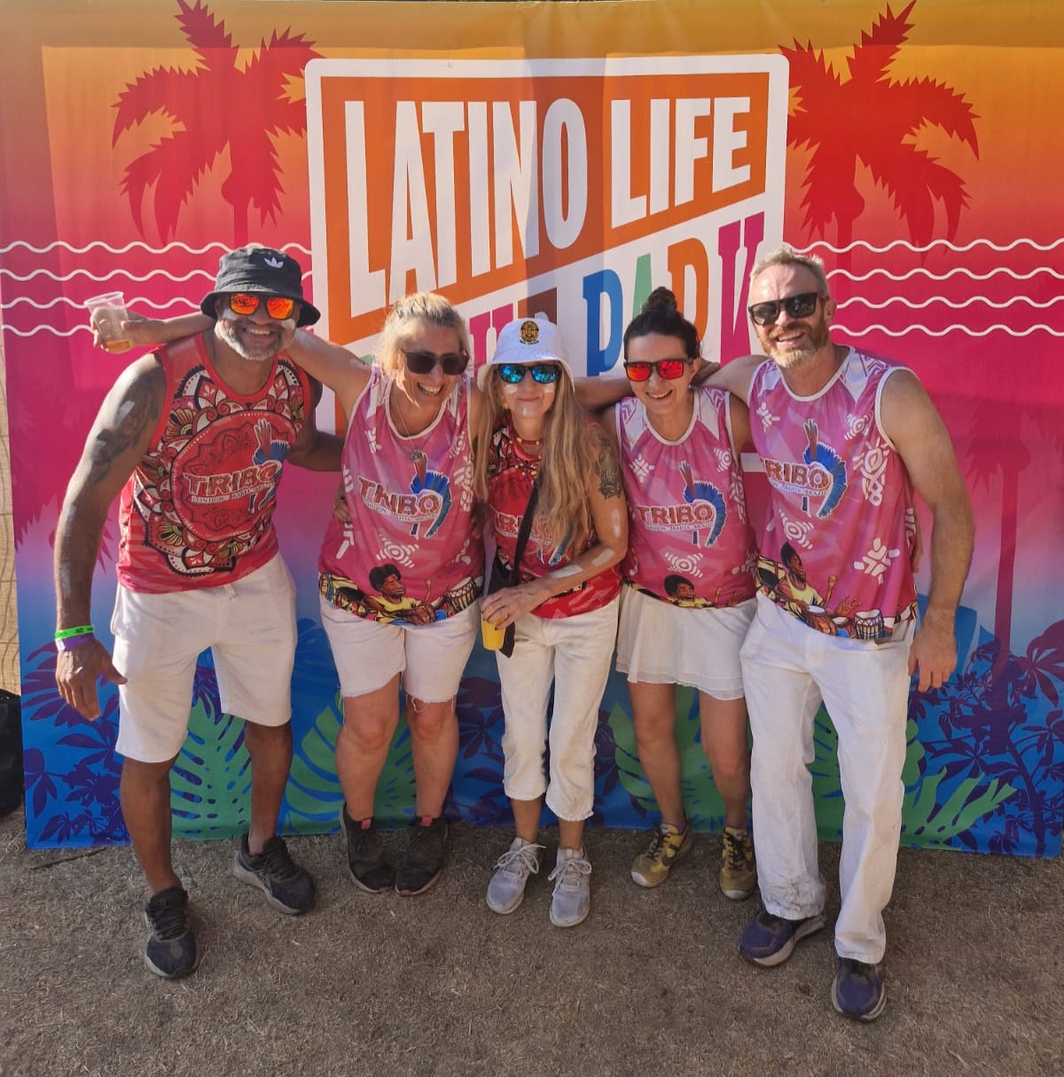 Five TRIBO members in band vests at the Latino Life in the Park festival